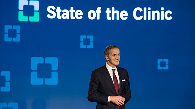 Dr. Mihaljevic presenting in front of a backdrop that says State of the Clinic.