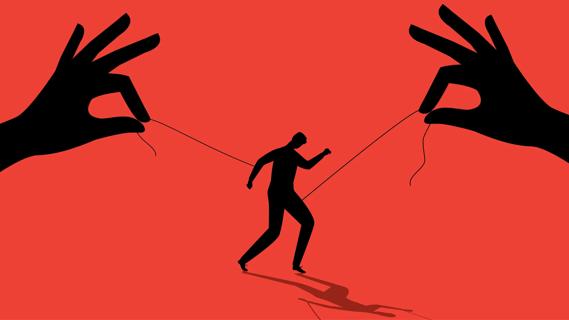 Silhouette of puppeteering hands with strings controlling a person