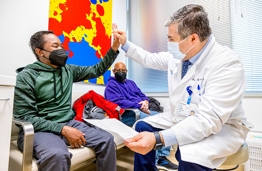 Cleveland Clinic doctor and patient high-fiving.
