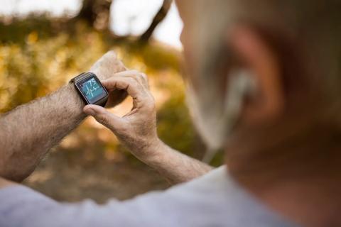 Person checking their heart rate on smartwatch